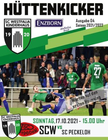 Sportaufnahme eines Fußballspiels, die Spieler auf dem Spielfeld und Zuschauer in der Tribüne zeigt.
