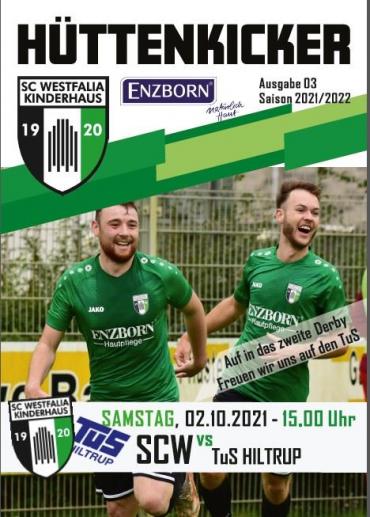 Titelseite eines Sportmagazins mit zwei Fußballspielern vor einem Spielfeldrand.
